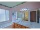 Bathroom with a double vanity, bathtub and shower at 9509 Se 124Th Loop, Summerfield, FL 34491