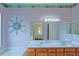Bathroom featuring a double sink vanity, large mirror, and bathtub at 9509 Se 124Th Loop, Summerfield, FL 34491