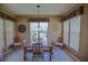 Bright dining room featuring a large window and views of the yard and lots of natural light at 9509 Se 124Th Loop, Summerfield, FL 34491