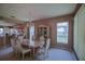 Traditional dining room area with chandelier, dining table with six chairs, and large cabinet at 9509 Se 124Th Loop, Summerfield, FL 34491