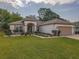 Inviting single-story home with a well-kept lawn and attractive landscaping at 9509 Se 124Th Loop, Summerfield, FL 34491