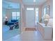 Bright foyer with tiled floors, leading to the living area, adorned with stylish furnishings and decor at 9509 Se 124Th Loop, Summerfield, FL 34491