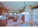 Spacious kitchen featuring stainless appliances, granite countertops, and a sunny breakfast nook with a chandelier at 9509 Se 124Th Loop, Summerfield, FL 34491