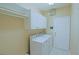 Laundry room includes modern appliances and plenty of storage at 9509 Se 124Th Loop, Summerfield, FL 34491
