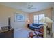 Cozy room with comfortable seating, natural light, and a ceiling fan, offering a relaxing atmosphere at 9509 Se 124Th Loop, Summerfield, FL 34491