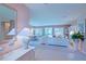 Open concept living area featuring tile flooring, elegant furnishings, and slider door access at 9509 Se 124Th Loop, Summerfield, FL 34491