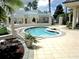 Community hot tub with pergola and tiled patio at 9509 Se 124Th Loop, Summerfield, FL 34491