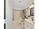 Cozy bathroom with a shower-tub combo, vanity, and a neutral color palette at 9820 Sw 89Th Ter # B, Ocala, FL 34481