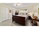 Bright bedroom with a ceiling fan, and ensuite bathroom offers comfort and convenience at 9820 Sw 89Th Ter # B, Ocala, FL 34481