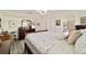 Comfortable bedroom with zebra print bedding, adjacent bathroom, and ample closet space at 9820 Sw 89Th Ter # B, Ocala, FL 34481