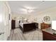 Serene bedroom with wood flooring, neutral walls, and a comfortable bed at 9820 Sw 89Th Ter # B, Ocala, FL 34481