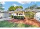 Charming single story home boasts a manicured lawn, attached garage, and covered entryway with space to sit at 9820 Sw 89Th Ter # B, Ocala, FL 34481