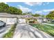 Charming single story home boasts a manicured lawn, attached garage, and covered entryway with space to sit at 9820 Sw 89Th Ter # B, Ocala, FL 34481