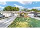 Charming single story home boasts a manicured lawn, attached garage, and covered entryway with space to sit at 9820 Sw 89Th Ter # B, Ocala, FL 34481
