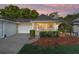 Charming single story home boasts a manicured lawn, attached garage, and covered entryway with space to sit at 9820 Sw 89Th Ter # B, Ocala, FL 34481