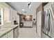 Well-lit kitchen featuring updated countertops, stainless steel appliances, and ample cabinet space at 9820 Sw 89Th Ter # B, Ocala, FL 34481