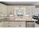 Bright and airy kitchen area with a window view above the sink at 9820 Sw 89Th Ter # B, Ocala, FL 34481