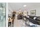 Inviting living room with neutral walls, tile flooring, and contemporary furnishings for a stylish, comfortable space at 9820 Sw 89Th Ter # B, Ocala, FL 34481