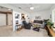 Cozy living area with comfortable seating, a ceiling fan, and access to the kitchen at 9820 Sw 89Th Ter # B, Ocala, FL 34481