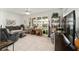 Inviting living room with bright natural light, neutral tones, and a ceiling fan at 9820 Sw 89Th Ter # B, Ocala, FL 34481