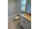 Bright bathroom with granite counters, tiled floor, and shower-tub combo at 2166 Nw 23Rd Loop, Ocala, FL 34475