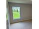 Bright bedroom featuring neutral walls, carpet floors and large window letting in plenty of natural light at 2166 Nw 23Rd Loop, Ocala, FL 34475