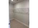 A walk-in closet with white wire shelving along the top of the wall and carpet flooring at 2166 Nw 23Rd Loop, Ocala, FL 34475