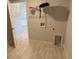A laundry room featuring a shelf for storage, tile floors, and washer/dryer hookups at 2166 Nw 23Rd Loop, Ocala, FL 34475