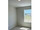 Bright bedroom featuring a large window that fills the room with natural light, enhancing the space at 2218 Nw 23Rd Loop, Ocala, FL 34475