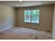 Bright bedroom featuring a large window that fills the room with natural light, enhancing the space at 2218 Nw 23Rd Loop, Ocala, FL 34475