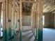 Framed bathroom featuring a tub, studs, concrete floor, and electrical wiring at 4522 Sw 90Th Lane Rd, Ocala, FL 34476