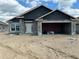 Unfinished exterior of home featuring cinder block walls, covered entry and attached garage at 4522 Sw 90Th Lane Rd, Ocala, FL 34476