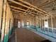 Exposed interior framing with insulation, concrete floors, open space, and visible studs at 4522 Sw 90Th Lane Rd, Ocala, FL 34476