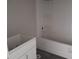 Bathroom with a white tub and a new vanity, creating a clean and functional space at 5810 Se 170Th Ct, Ocklawaha, FL 32179