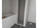 Bathroom featuring a walk-in shower, modern vanity, and stylish gray flooring at 5810 Se 170Th Ct, Ocklawaha, FL 32179