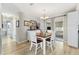 Charming dining area with a wooden table, bright natural light, and direct access to the screened patio at 10190 Se 178Th St, Summerfield, FL 34491