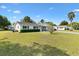 Lovely one-story house featuring blue shutters, a well-kept lawn, and mature trees at 10190 Se 178Th St, Summerfield, FL 34491