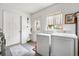 Clean laundry room with washer and dryer, two doors, and a window with curtains at 10190 Se 178Th St, Summerfield, FL 34491