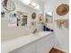 Well-lit bathroom features a sink with vanity and storage and unique decor at 10385 Se 178Th St, Summerfield, FL 34491