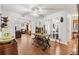 Cozy dining area featuring hardwood floors, a rustic dining set, and natural light, perfect for Gathering gatherings at 10385 Se 178Th St, Summerfield, FL 34491
