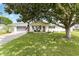 Charming home featuring a well-maintained lawn and lovely landscaping, with an inviting entrance and screened garage at 10385 Se 178Th St, Summerfield, FL 34491