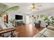 Comfortable living room featuring hardwood floors, stylish decor, and a welcoming atmosphere, ideal for unwinding at 10385 Se 178Th St, Summerfield, FL 34491
