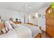 Comfortable main bedroom features wood floors and ample closet space for optimal storage at 10385 Se 178Th St, Summerfield, FL 34491
