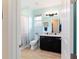 Bathroom featuring bright walls, a black vanity, a toilet, and a tub with a shower at 10445 Sw 90Th Street Rd, Ocala, FL 34481
