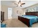 Comfortable bedroom with a ceiling fan and an oversized window bringing in light at 10445 Sw 90Th Street Rd, Ocala, FL 34481