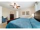 Bedroom featuring a plush bed, ceiling fan and neutral walls creating a cozy space at 10445 Sw 90Th Street Rd, Ocala, FL 34481