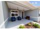 Inviting front porch with seating, pendant lighting, and stylish front door at 10445 Sw 90Th Street Rd, Ocala, FL 34481