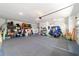 Large garage featuring epoxy floors, shelving, and enough room to store your lawn equipment at 10445 Sw 90Th Street Rd, Ocala, FL 34481