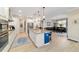 Bright, modern kitchen with white cabinets, granite countertops, and a large island perfect for entertaining at 10445 Sw 90Th Street Rd, Ocala, FL 34481