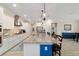 Well-equipped kitchen with stainless steel appliances, granite countertops, and a large island for seating and cooking at 10445 Sw 90Th Street Rd, Ocala, FL 34481